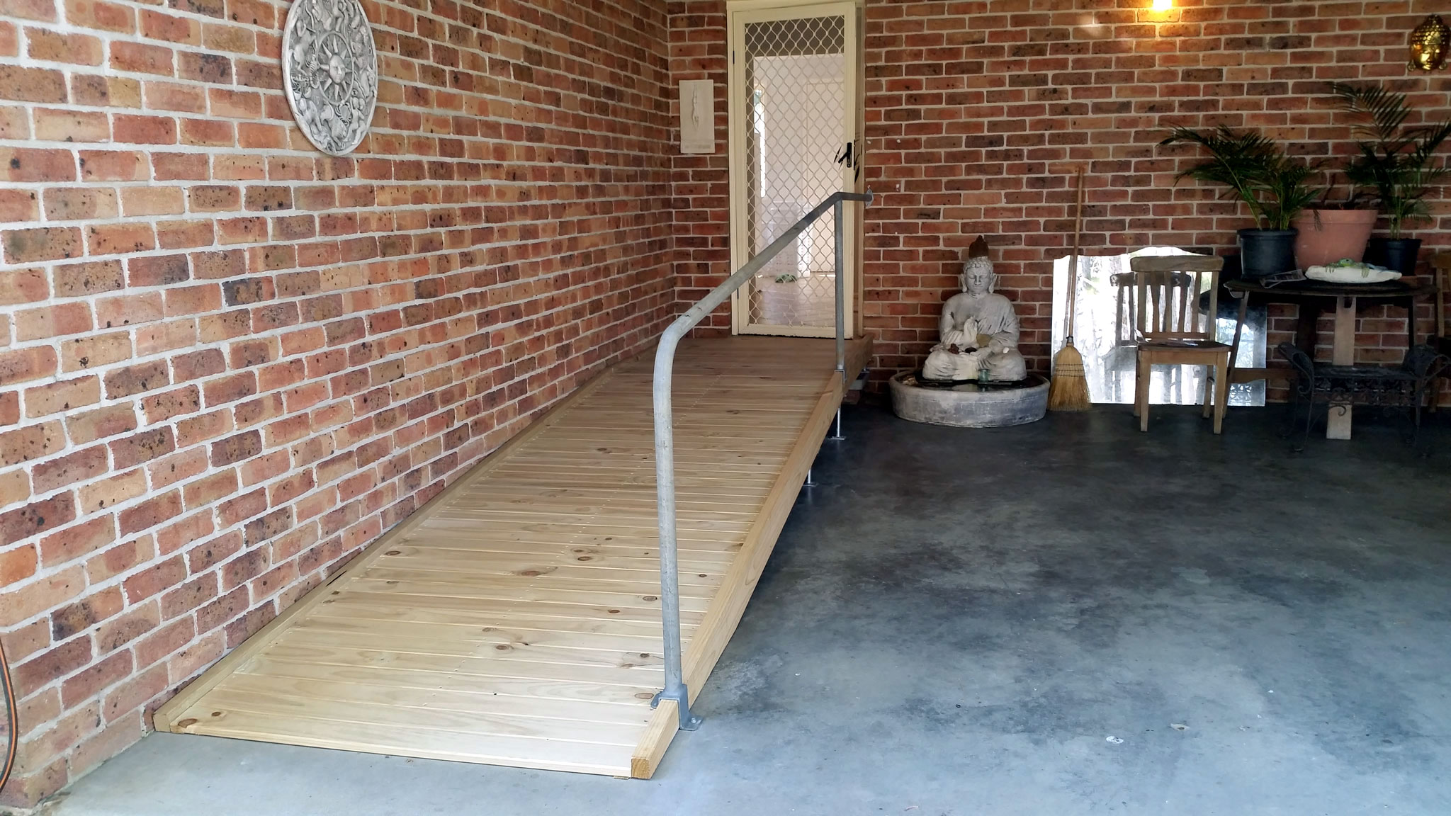 Photo showing a disability ramp constructed by the shed
