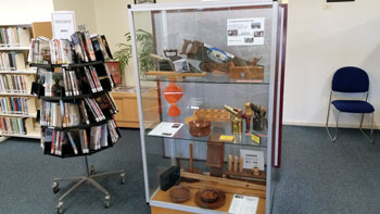 Photo of a display case of Men's Shed products in the local library