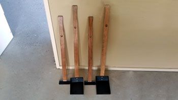 Photo showing a pair of poop scoops made by the shed